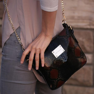 black-brown-leather-designer-messenger-handbag-crossbody-lifestyle